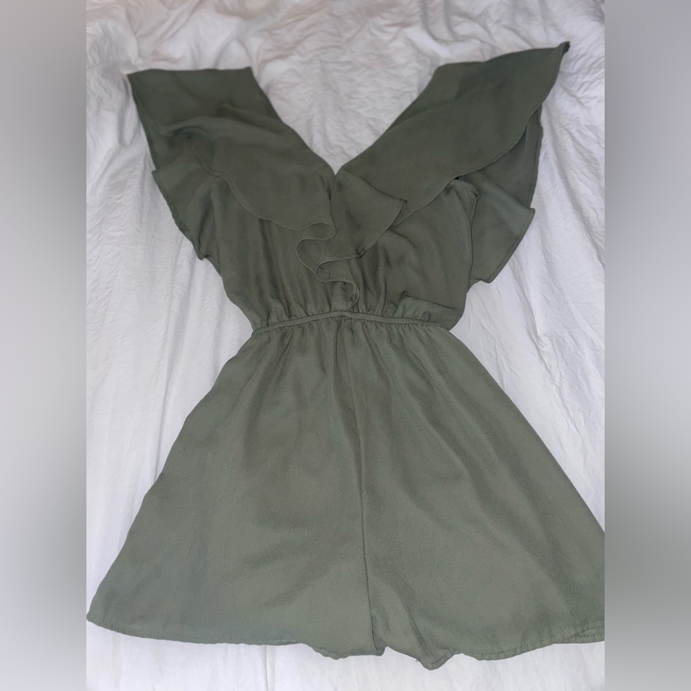 Green romper with v line cut